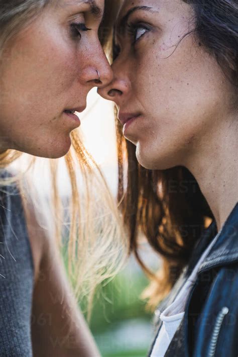 Close Up Of Affectionate Lesbian Couple About To Kiss Stock Photo