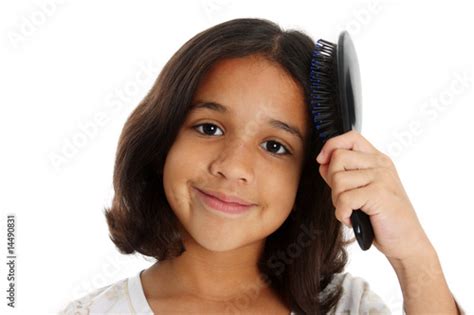 Girl Brushing Hair Stock Photo Adobe Stock