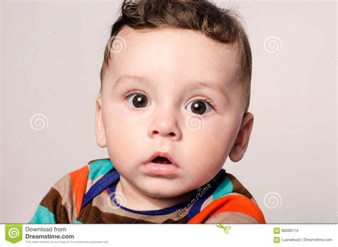 Portrait Of A Cute Baby Boy Looking At Camera Stock Photo Image Of