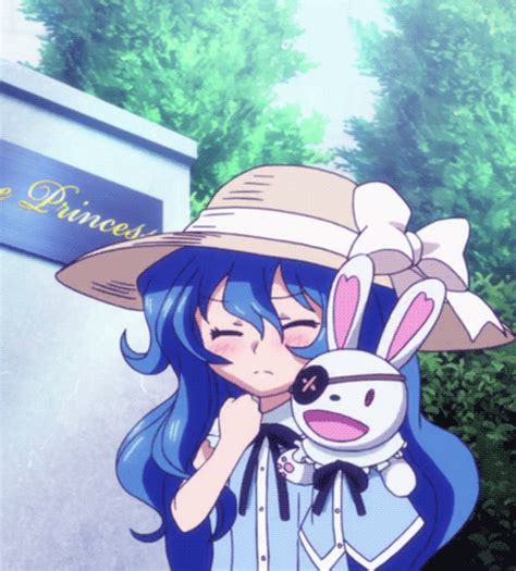 An Anime Girl With Blue Hair And Bunny Ears Holding A Stuffed Animal In
