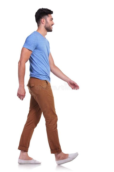 Side View Of A Casual Man Walking Forward And Smiling Royalty Free