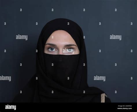 portrait of muslim woman wearing niqab and traditional arabic clothes or abaya arab woman