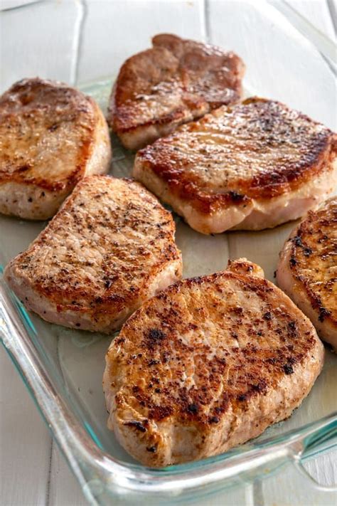 Add the browned pork chops, garlic, cream of mushroom soup, beef broth, and worcestershire sauce to the instant pot. These cream of mushroom pork chops were so simple, will ...