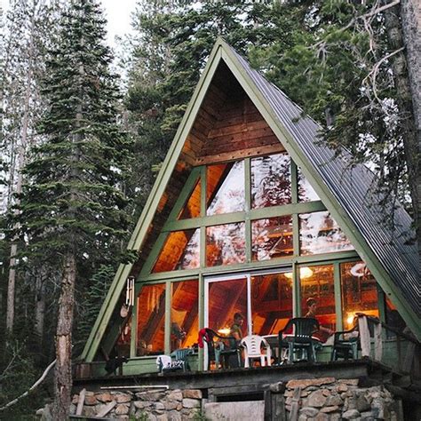 Building cabin in the woods. It's in the woods and has those beautiful big windows ...