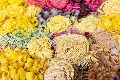 Many Types Of Uncooked Italian Pasta Of Various Colors And