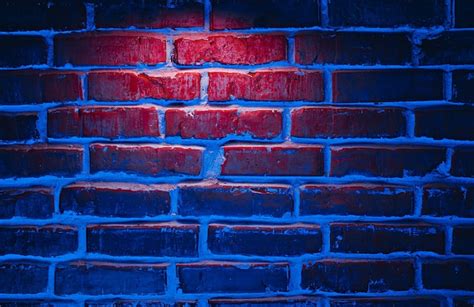 Premium Photo Brick Wall Texture Background In Red And Blue Neon Lights