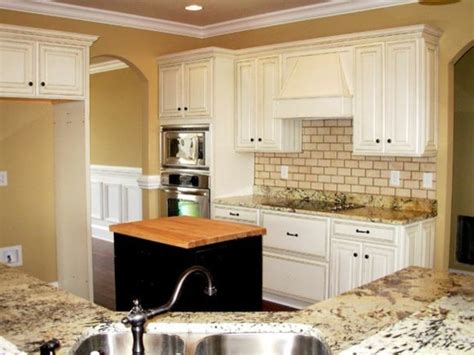 Pack a punch with freshly painted kitchen cabinets. Painted, Distressed Kitchen Cabinets - Traditional ...