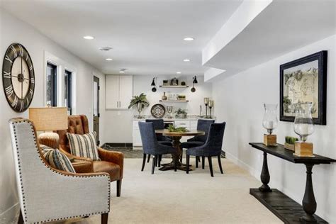 Center your space with a gorgeous coffee table, and add side tables for displaying plants, photos, and treasures (and as parking spots for delicious beverages!). Sitting Room With Wet Bar Featuring Wooden Dining Table | HGTV