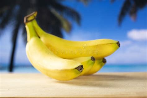 Fresh Yellow Banana With Palm Beach Behind Stock Image Image Of Blue