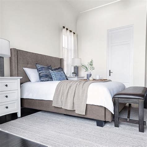 That's why we've prepared these alternatively, arrange furniture partially on top, with the rug sitting underneath the front two legs of your sofa and side chairs. rug placement | Upholstered platform bed, Grey upholstered ...