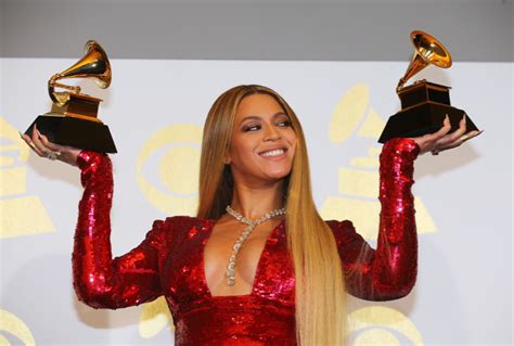 Beyonce Holds The Awards She Won At The 59th Annual Grammy Awards In Los Angeles Qcity Metro