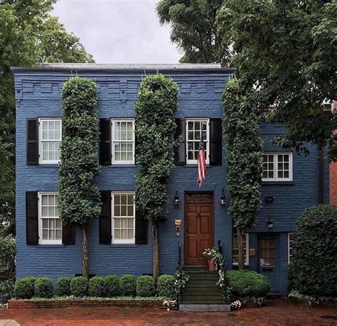 The Painted Blue Brick And Shutters Create For A Beautiful Exterior On