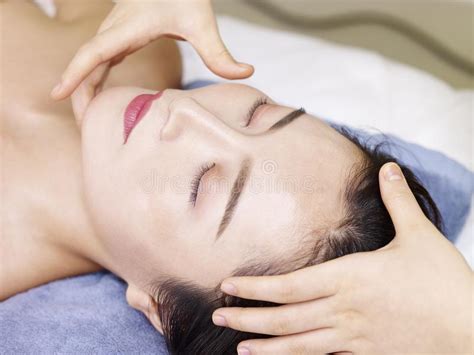 Young Asian Woman Receiving Face Massage In Spa Salon Stock Image Image Of Beautiful Hands