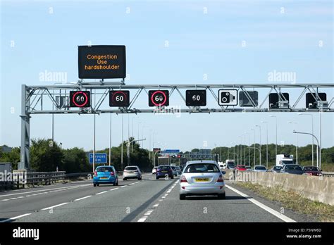 Traffic On The M5 Motorway A Overhead Gantry Shows Congestion