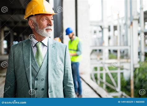 Confident Construction Engineer Architect Businessman In Hardhat On