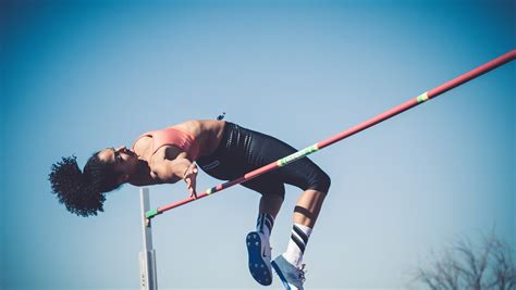 Woman Arching Her Body Over A High Jump Pole Modestack