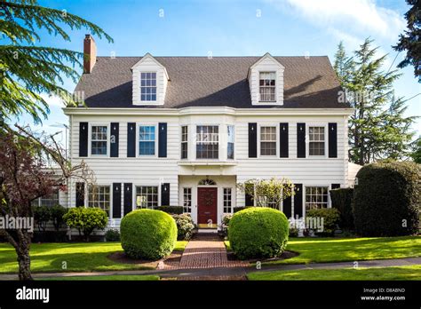 Classic American Suburban House With Blue Sky Background Stock Photo