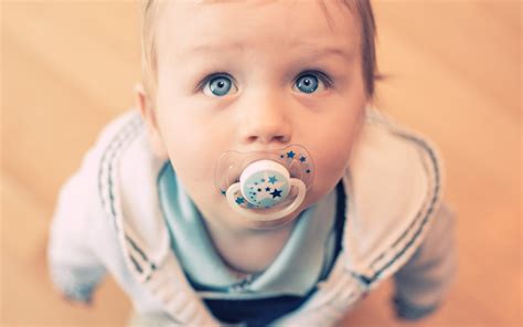 2560x1600 Baby Look Blue Eyes Pacifier Wallpaper Coolwallpapersme