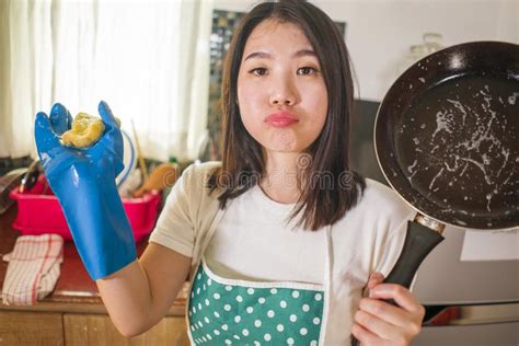 Domestic Chores Lifestyle Portrait Of Young Tired And Stressed Asian