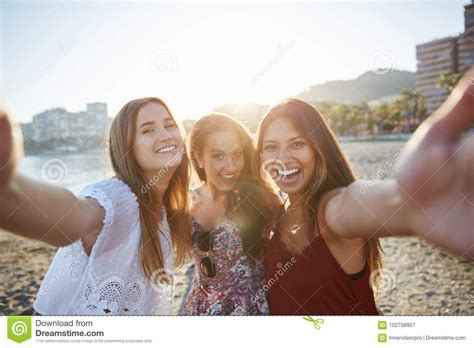 Three Happy Female Friends Taking Selfie On Beach Stock Image Image