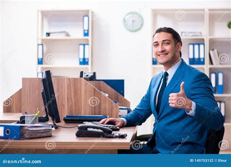 Young Handsome Businessman Sitting In The Office Stock Photo Image Of