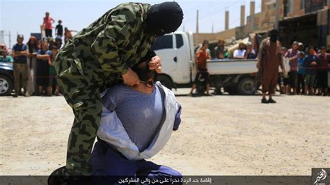 Extremely Graphic Photos Islamic State Beheads Men Accused Of Mocking