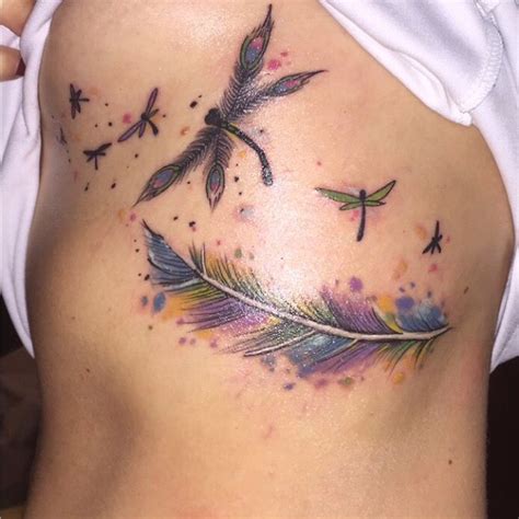 Dragonfly tattoo designs are a great option for those of you who love the design simple and always look good wherever you chiefly. Dragonfly feather tattoo on rib cage | Dragonfly tattoo ...