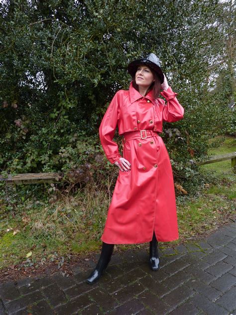 red is the colour of passion check out this beautiful babe in her hot red rubber rainwear