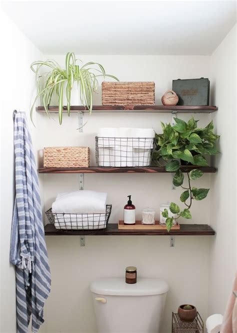 If you're concerned that shelving will look bulky or cluttered in your small bathroom, this dark gray design by small.flat.ideas found on instagram is a great alternative. 26 SImple Bathroom Wall Storage Ideas - Shelterness