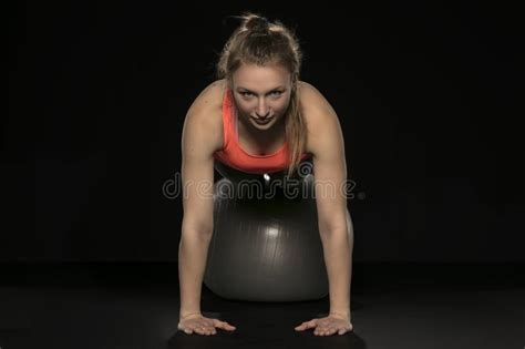 Beautiful Young Athletic Woman Exercising With A Gymnastics Ball Stock