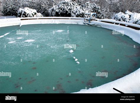 A Frozen Outdoor Swimming Pool In Winter Uk Stock Photo Alamy