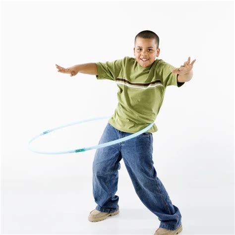 Boy Using Hula Hoop — Stock Photo © Iofoto 9312147