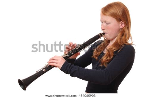 Portrait Teenage Girl Playing Clarinet On Stock Photo