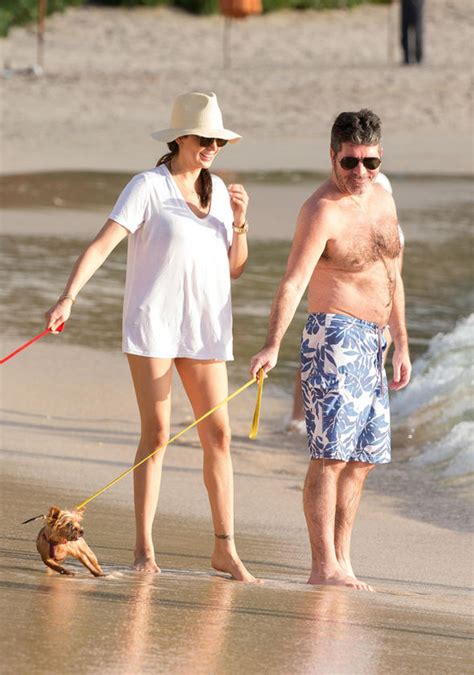 simon cowell and lauren silverman kiss on annual break in barbados