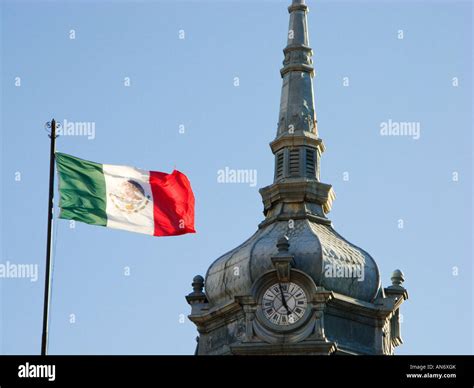 Mexico Guanajuato Mexican Flag Waving Next To Tower Of Mercado Hidalgo