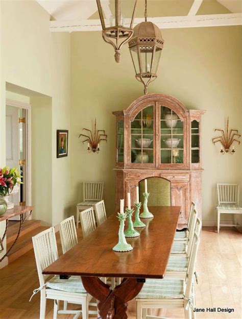 It features beige walls, a light beige floor, a white. Rustic style dining room in a French Country home in soft ...