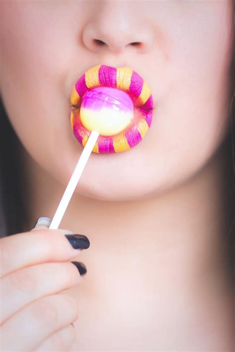 Free Photo Woman Licking Pink And White Lollipop Adorable Lollipop Woman Free Download
