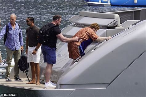 exclusive image sir elton john gets on a yacht with husband david furnish in southern france