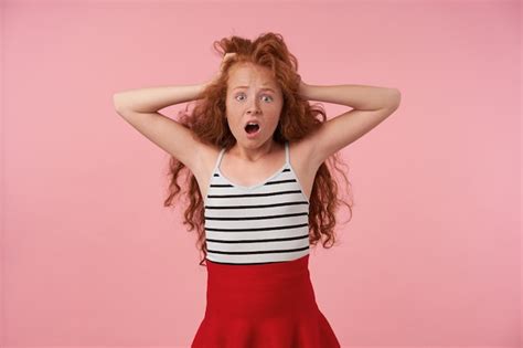 Free Photo Studio Photo Of Shocked Curly Redhead Girl In Festive