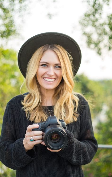 Portrait Of A Beautiful Blonde Photographer Holding Camera Stocksy United Photographer
