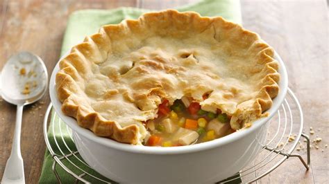 Lightened up healthy chicken pot pie made with a whole grain flaky crust and sauce made with almond milk & chicken broth instead of butter and cream! Easy Chicken Pot Pie recipe from Pillsbury.com