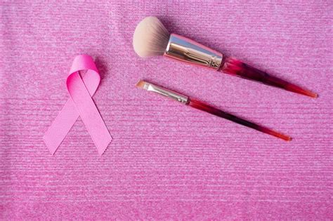 Premium Photo Breast Cancer Awareness Month With Pink Ribbon And Makeup Brushes
