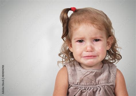Portrait Of Sad Crying Baby Girl Foto De Stock Adobe Stock