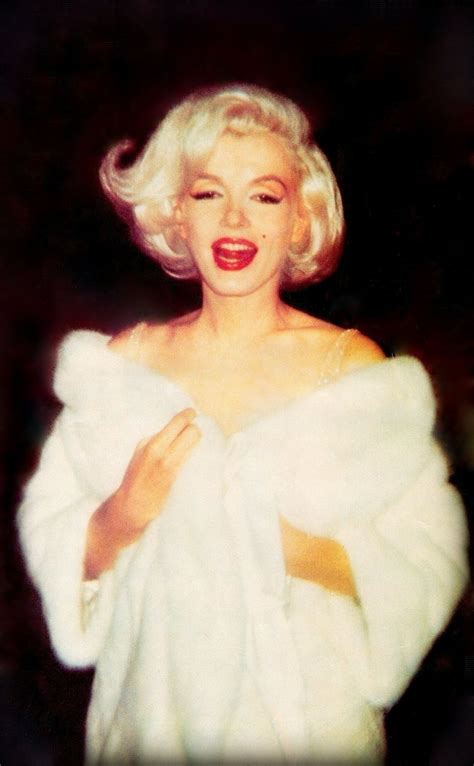 marilyn monroe rare colour photo with a white ermine fur coat thrown over her million dollar