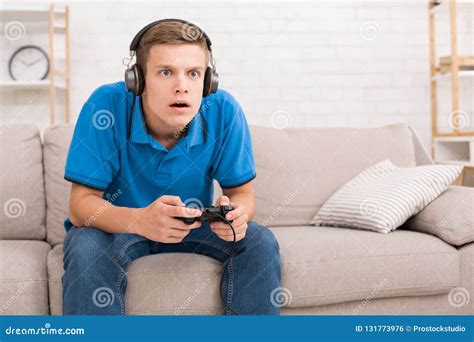 Teen Guy Playing Video Games With Joystick Stock Photo Image Of Hobby