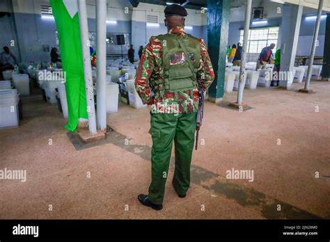 A Police Officer Guards Electoral Ballot Boxes Before The Elections At A Tallying Center In
