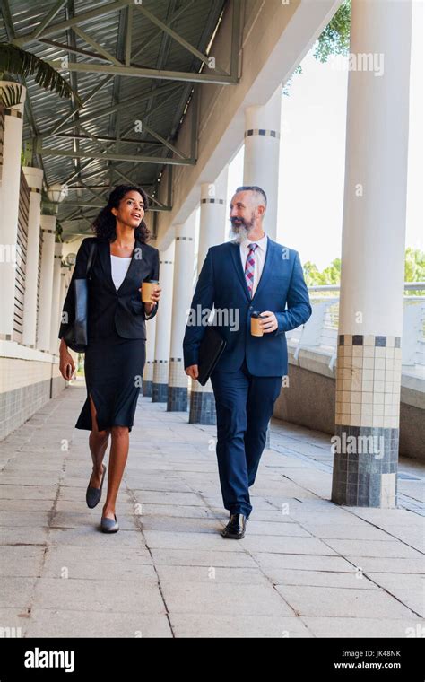 Business People Walking On Sidewalk Stock Photo Alamy