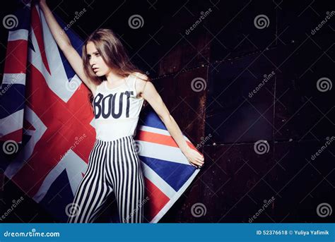 Portrait Of A Beautiful Young Girl With A British Flag Stock Photo