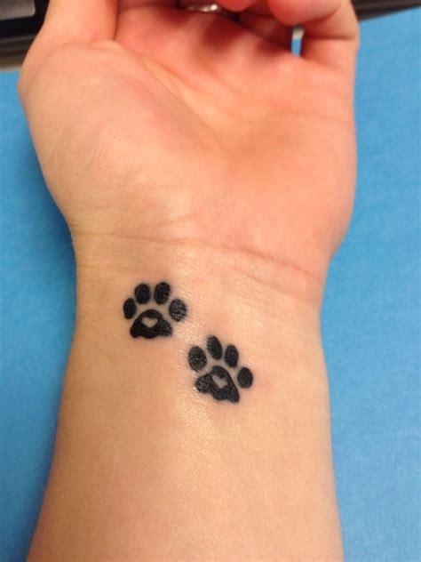 Where to put a small dog paw tattoo? Cute small paw print tattoo. I think I'm going to get this ...