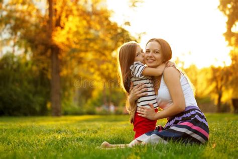 Daughter Kiss Her Mother Happiness Stock Image Image Of Grass Female 77637031